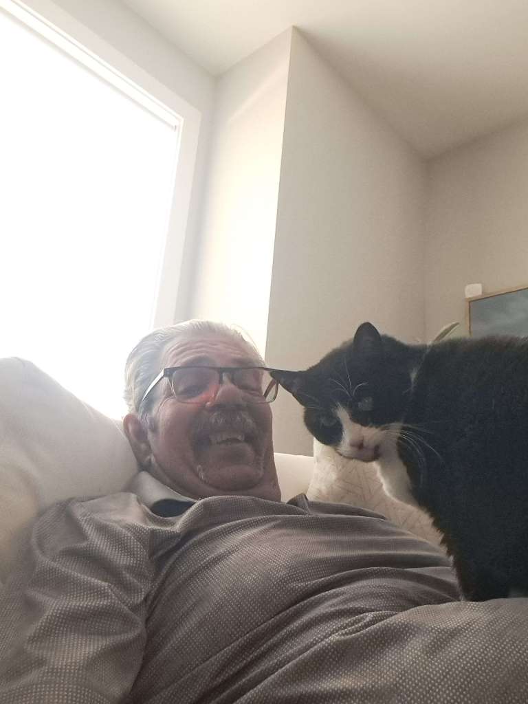 Frank pet sitting with Piper the cat.